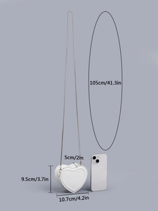Size diagram of heart mini crossbody bag with metal chain and smartphone size reference