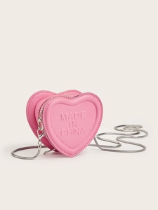 Detail of pink heart-shaped mini chain bag with embossed texture and silver strap