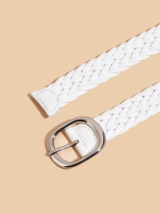 Detail shot of white braided faux leather belt with a silver oval metal pin buckle