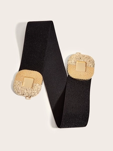 Detail of black elastic wide belt featuring vintage gold square textured metal buckles