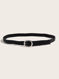 Detail of black woven leather belt featuring a classic silver oval metal buckle