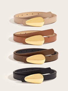 Close-up of four slim leather belts for women with unique golden waterdrop buckles