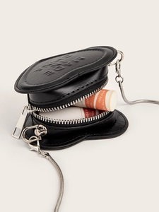 Detail of heart-shaped mini crossbody bag in black lychee leather with silver chain