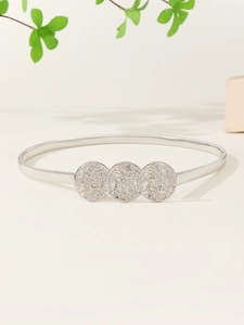 Detail of silver elastic metal waist chain with three textured round embossed buckles