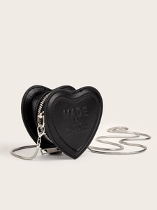 Close-up of heart-shaped black leather mini bag with silver chain and zipper closure