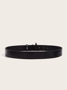 Detail view of black embossed crocodile pattern leather belt with minimalist buckle