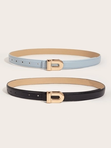 Detail view of slim black and sky blue belts featuring golden D-shaped metal buckles
