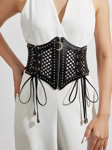 Detail of gothic black PU leather waist corset with metal rivets and moon pendant zipper