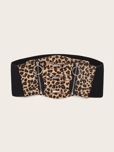 Detail of leopard print wide elastic waist belt with metal buckles and star rivets