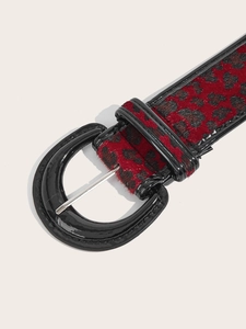 Close-up of red leopard print belt with faux hair texture and large oval buckle