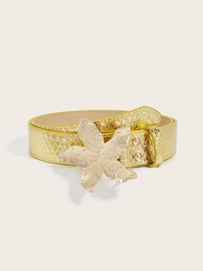 Detail of gold starfish buckle and snakeskin texture on elegant fashion belt for women