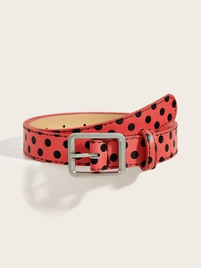 Detail of red leather Y2K belt featuring black polka dots and silver square metal buckle