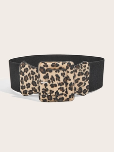 Detail view of fashion wide elastic belt with leopard print buckle and silver metal pin