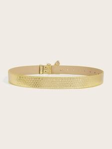 Detail of gold faux snake skin belt featuring a shiny metal buckle and adjustment holes