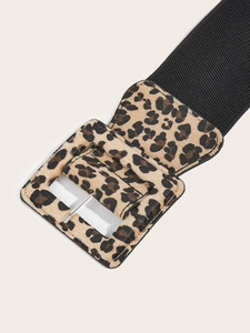Detail of wide elastic waist belt featuring a leopard print texture and square buckle