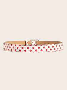 Detail of red polka dot white leather belt with silver square metal buckle and red stitching