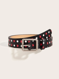 Detail of Y2K vintage black belt featuring red heart patterns and silver metal buckle