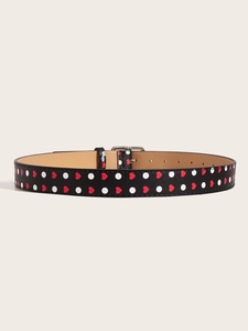 Close-up of Y2K vintage belt featuring red heart patterns and silver metallic buckle detail