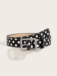 Detail of vintage Y2K black belt with white polka dots and silver square buckle
