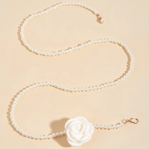 Elegant beaded pearl waist chain featuring a white fabric rose and golden metal clasp for women