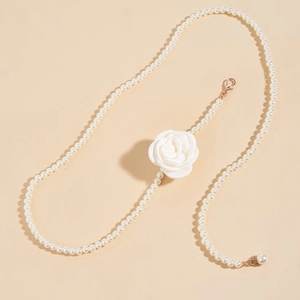 Elegant beaded waist chain with white faux pearls and a delicate fabric rose decoration