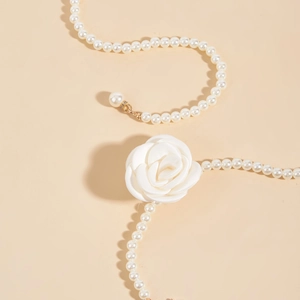 Elegant white camellia pearl waist chain for dresses featuring a gold metal clasp hook