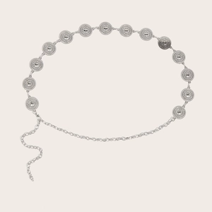 Detailed macro view of silver sunburst medallion links and adjustable lobster clasp chain