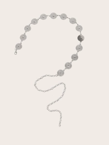 Detail of silver bohemian waist chain featuring embossed sunflower relief metal discs