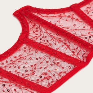 Red mesh corset top with sequins and fishbone support for a slim fit commute