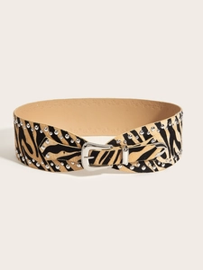 Detail of zebra print wide belt with silver studs and engraved metal buckle