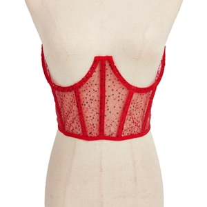 Elegant red sequin corset top with sheer mesh and structural boning on a mannequin