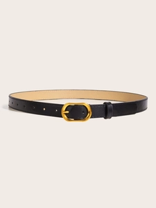 Close-up of slim black leather belt featuring a polished gold oval metal buckle