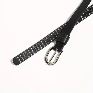 Trendy punk style black leather wide belt with three rows of silver studs and metal buckle