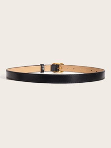 Detail of black leather belt with golden D-ring buckle and fine stitching texture
