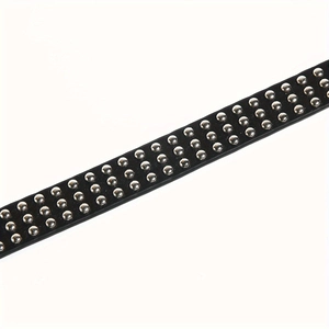 Detail of black punk leather belt featuring triple rows of polished silver metal studs