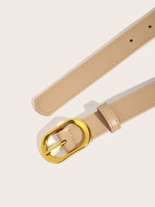 Detail of beige leather belt with golden oval metal buckle and neat edge stitching