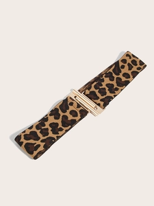 Detail of leopard print elastic waist belt featuring a shiny gold metallic buckle closure