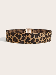Detail of leopard print wide elastic waist belt with rectangular golden metal buckle