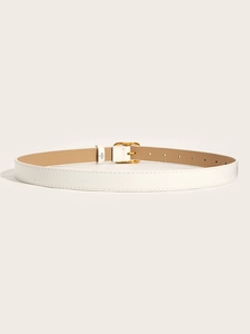 Detail of white thin faux leather belt featuring a polished gold oval metal buckle