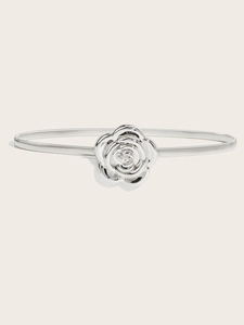 Detail of silver rose buckle on elastic snake chain metal belt for women's dresses