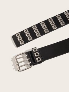 Close-up of a punk style double grommet black leather belt with silver square metal eyelets