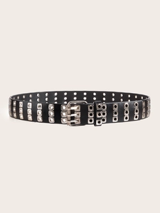 Detail of a punk style double-row grommet leather belt with silver square pin buckle
