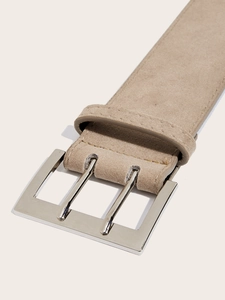 Detailed close-up of khaki suede belt showing silver double pin buckle and neat stitching