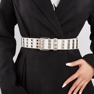 Punk style wide white belt with double row grommets and triple needle metal buckle on model