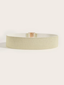 Detail of glitter gold elastic waist belt showing rose gold metal buckle and woven texture