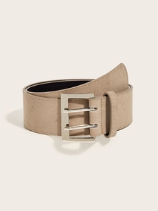 Detail of light khaki suede wide belt featuring a silver square double-prong metal buckle