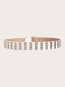 Detail of white double-row metal eyelet punk belt with silver buckle and khaki lining