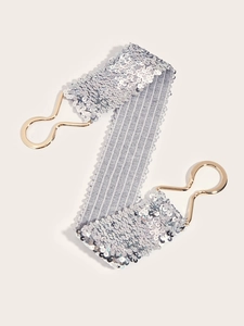Detail of silver sequin elastic waist belt for women with elegant golden metal buckle