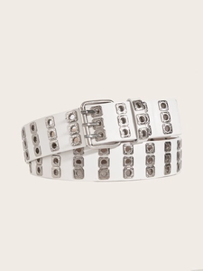 Close-up of white punk style triple-prong buckle belt with silver metal grommets