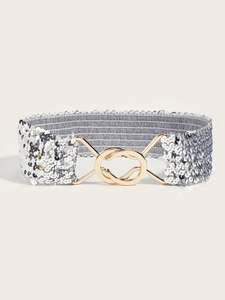 Detail of silver sequin elastic waist belt with a golden interlocking double-ring buckle